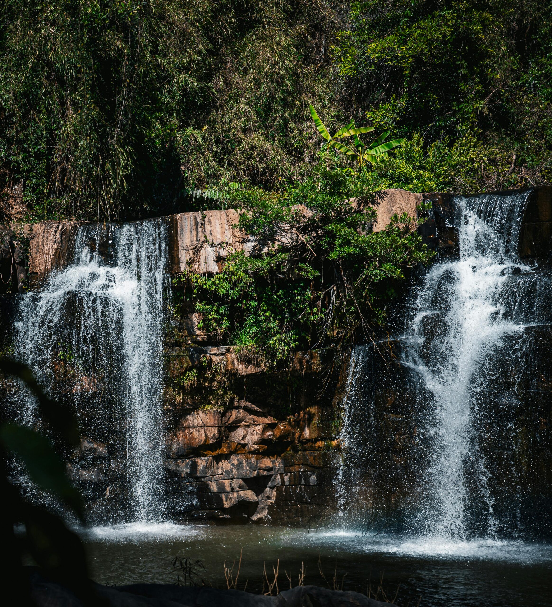 Stunning twin waterfall cascading in a lush Thailand jungle.